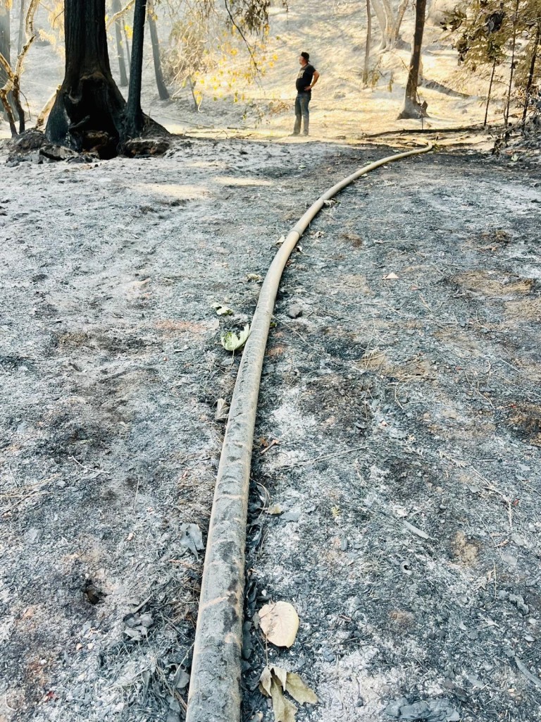 Trent Ghiringhelli stands near a burned pipe on his family's ranch near Aetna Springs. Marion Ghiringhelli photo