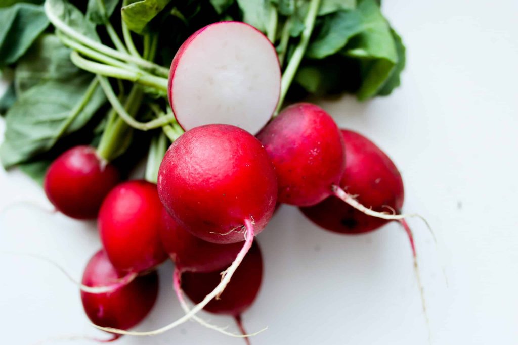 Radishes are an easy cool weather vegetable. Jo Lanta on Unsplash