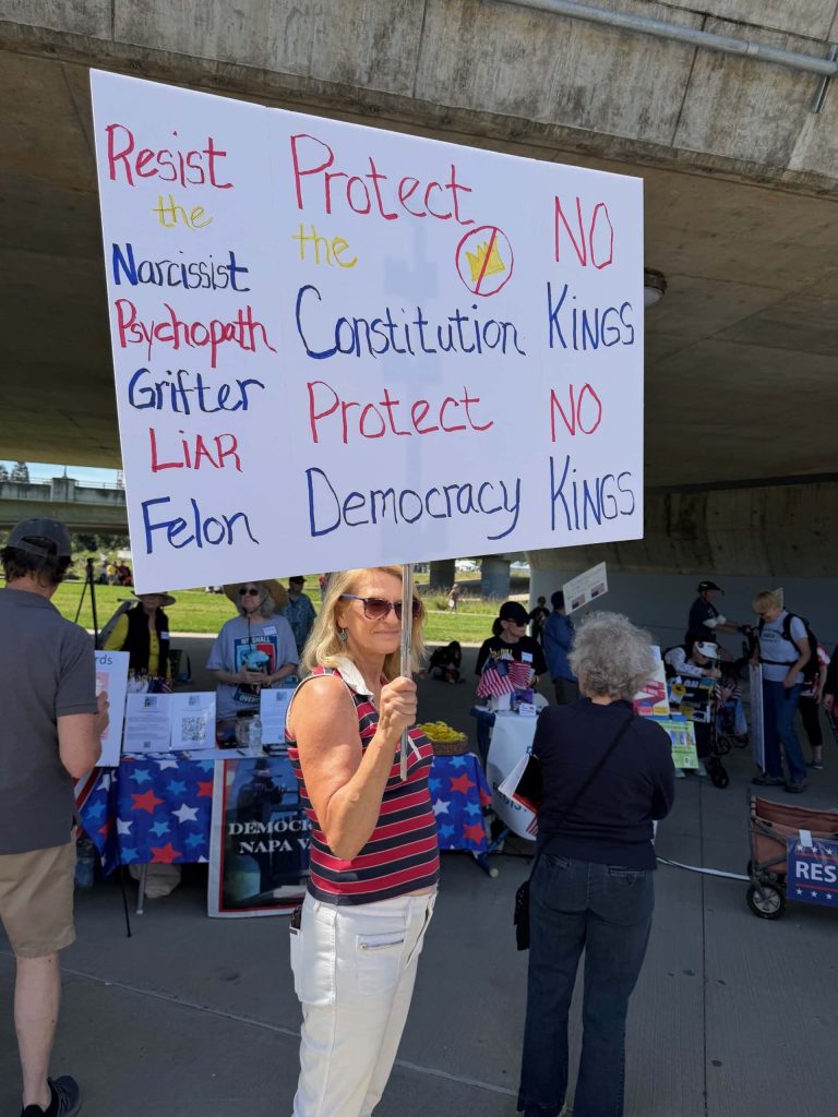 The crowd included out-of-town visitors who came to attend the rally and to tour Napa. Tomi Riley, a Contra Costa County resident, came with two friends, carrying a homemade sign. She said she wants to stop Trump. Kerana Todoro photo